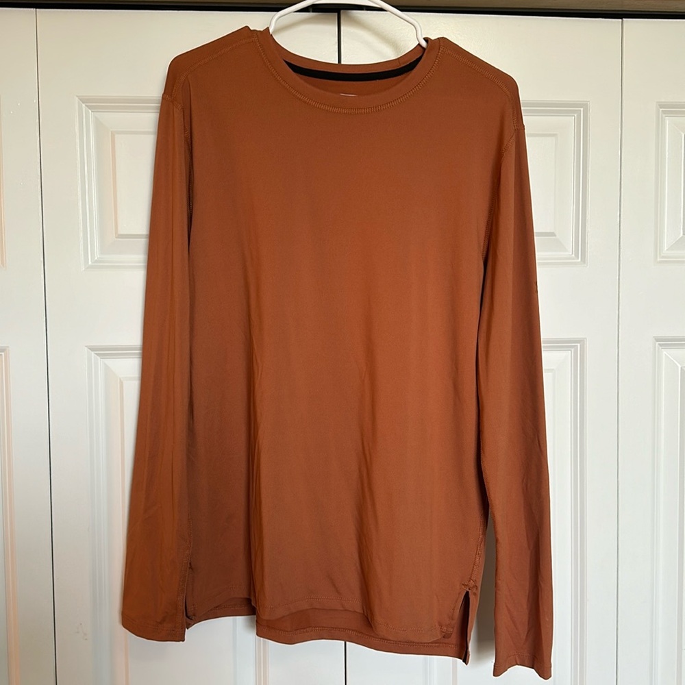 All in motion, long sleeve dri wick material, breathable and never worn.